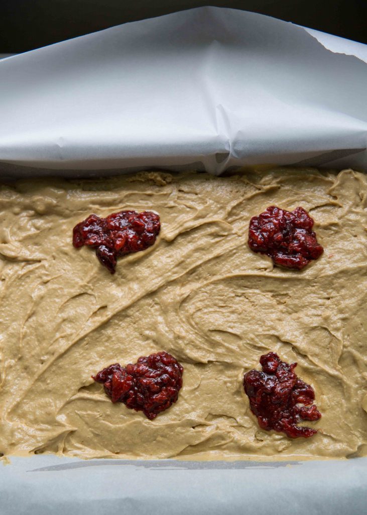 Drop clumps of jam on the brownie and then with a fork, scrape and swirl!