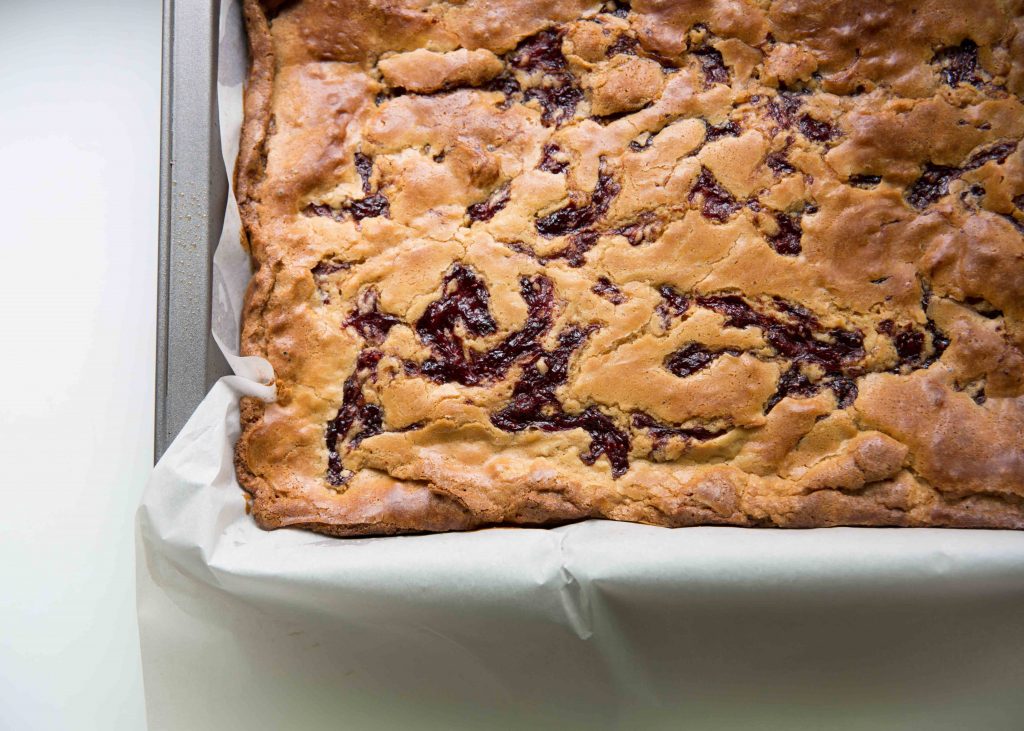 Once the brownies appear golden on the outside and cooked through, cool them thoroughly. Resist the temptation to cut into them before it's time!