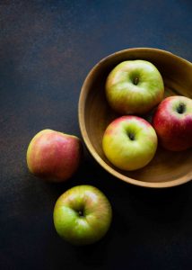 When making an Apple Maple Pecan Cobbler, choose a mix of tart and sweet apples like Granny Smith and Pink Lady apples.