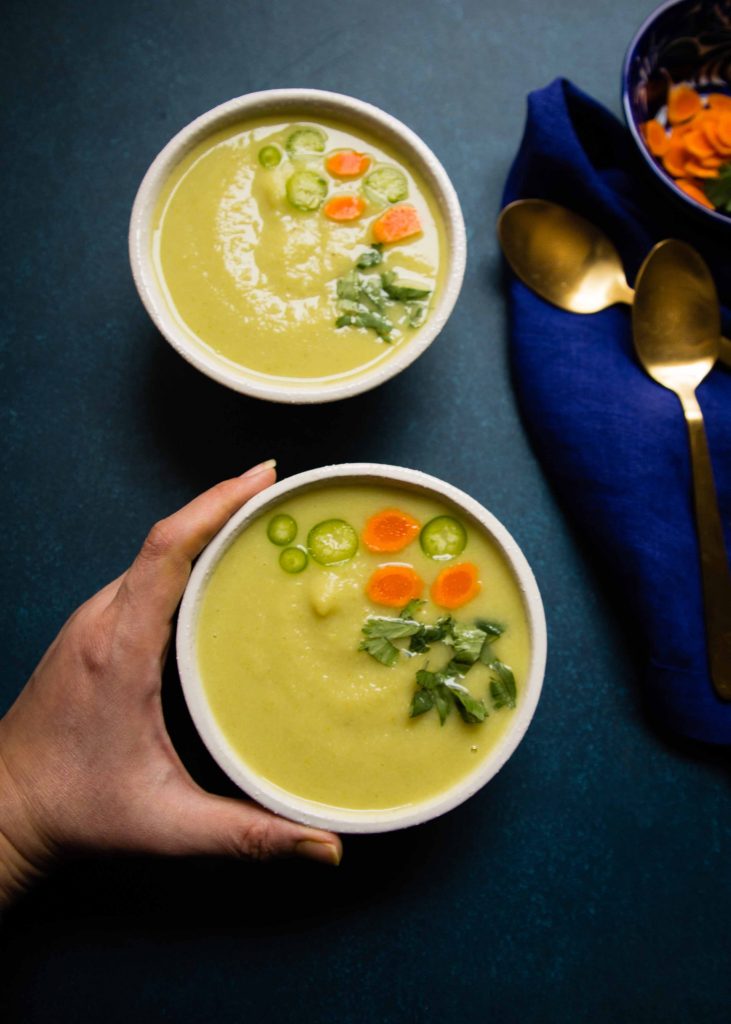 All sorts of green vegetables go into making Romanesco Soup, topped with a fresh shower of cilantro leaves and jalapeno.