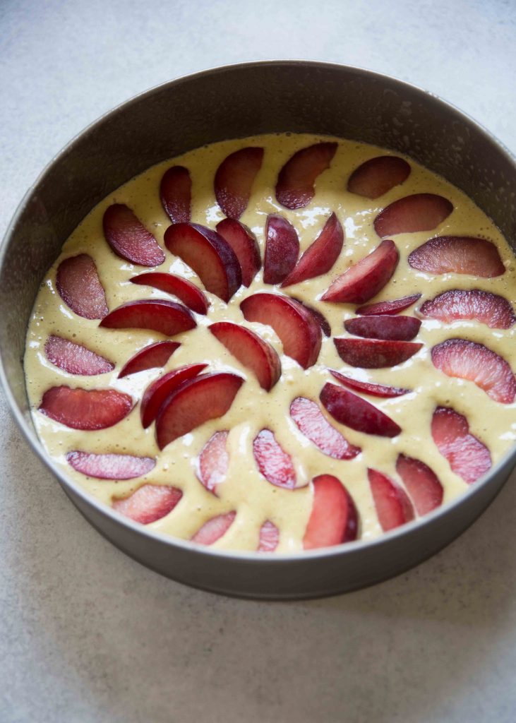 When making Sara Bir's Italian Plum Cake, lay the sliced plums in a single layer on the batter in the pan.